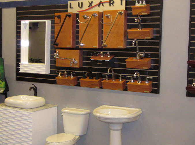Toilet, bathroom sink and cabinent hardware in the Hughes Daytona showroom