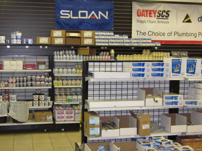 Professional plumbing supplies on shelves in plumbing warehouse